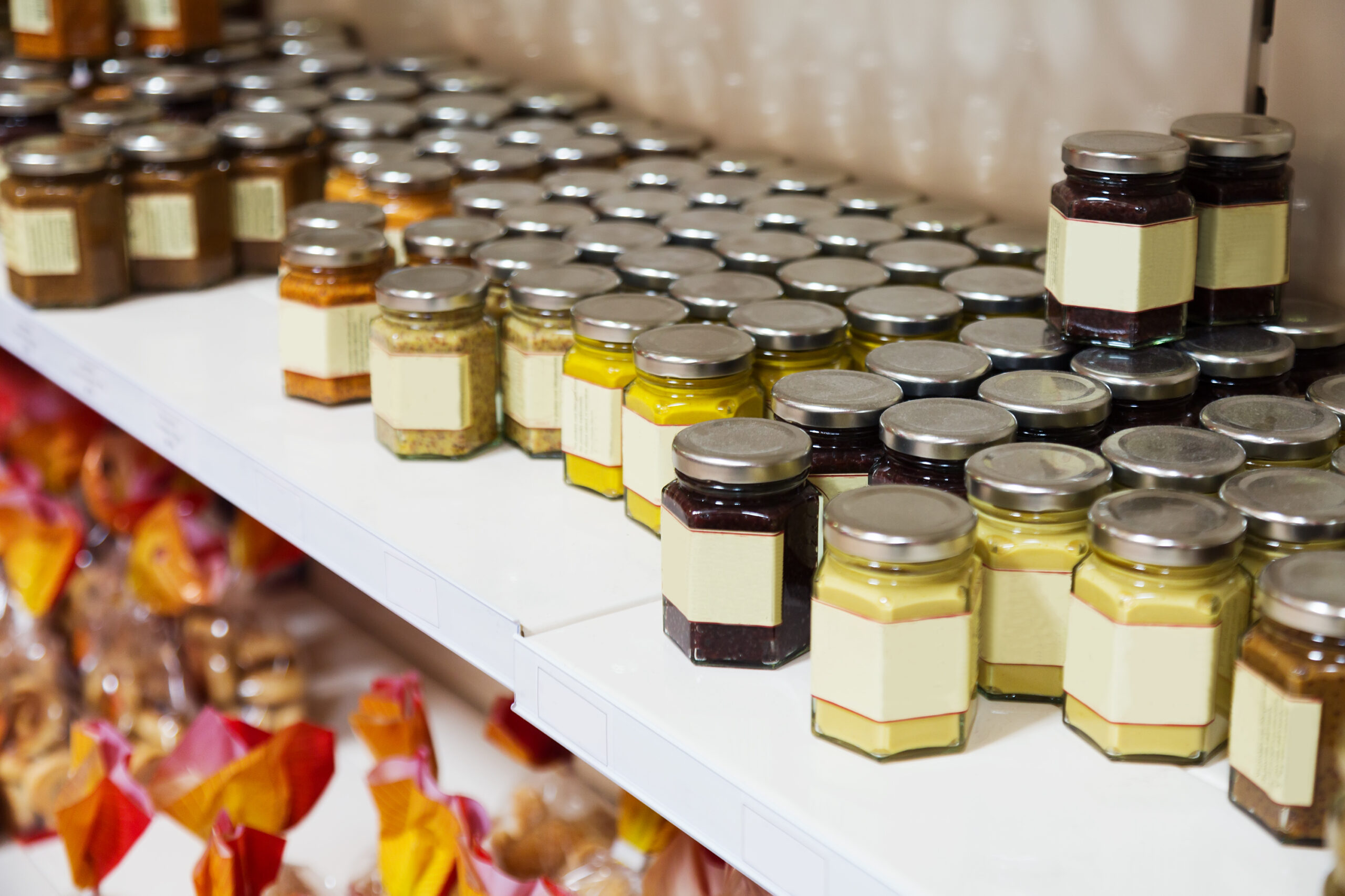 assortment of canned products on counter in shop