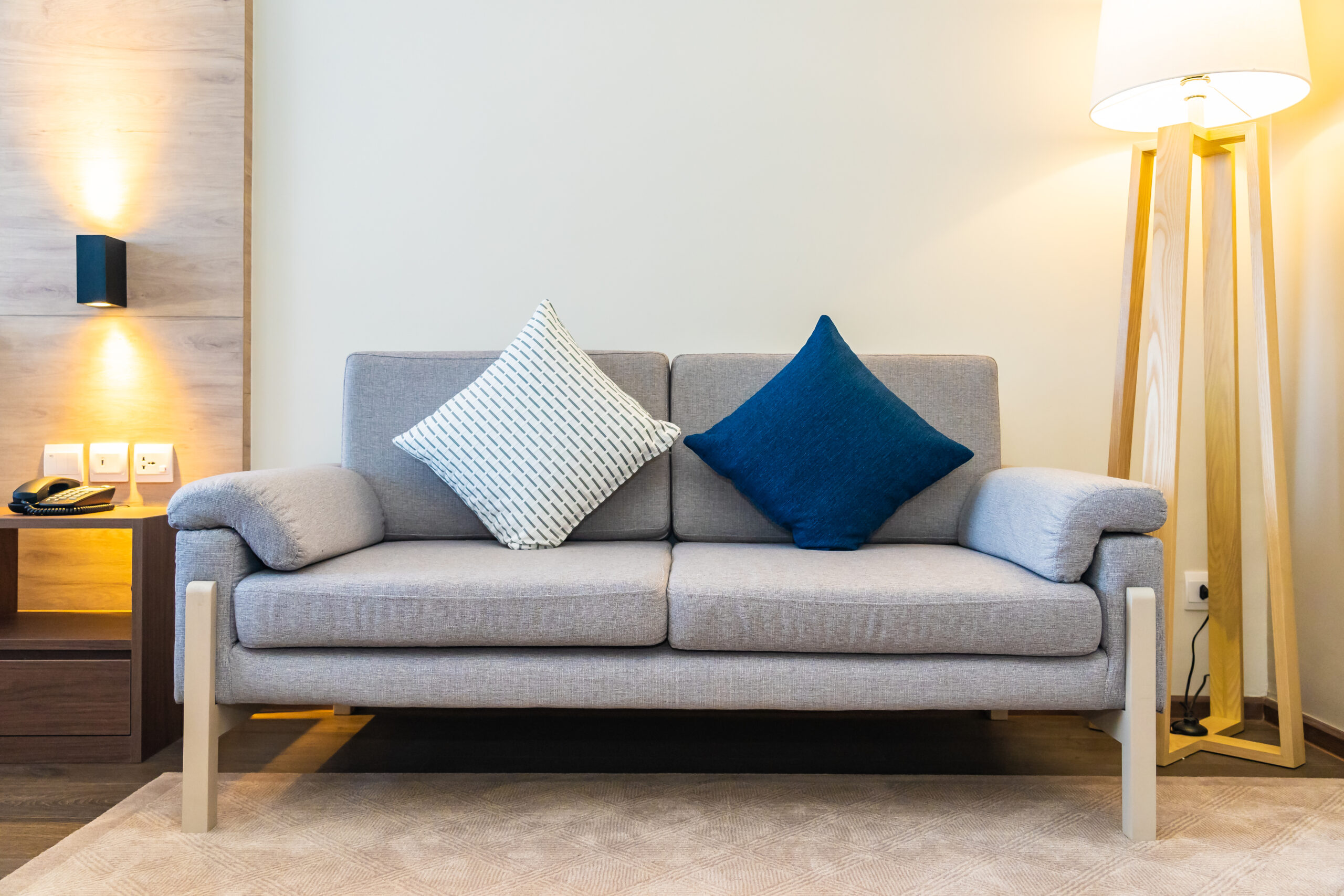 Comfortable pillow on sofa decoration with light lamp interior of living room area
